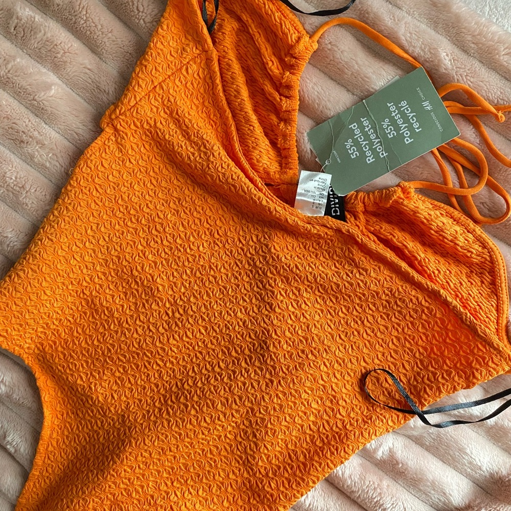 Orange body suit